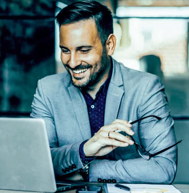 Man looking at a laptop.