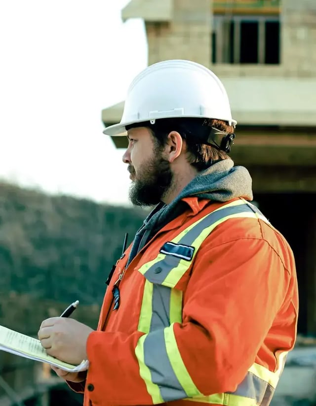 commercial-draw-inspector wearing hardhat on jobsite